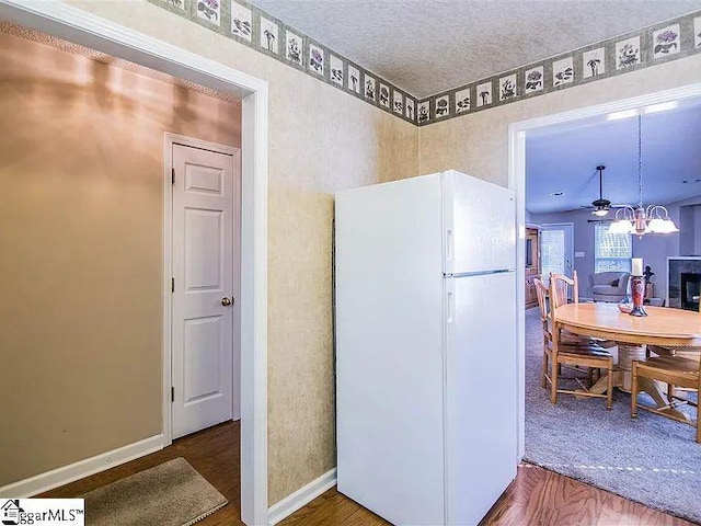 317 Farnsworth Rd, Spartanburg, SC 29301 - kitchen with freestanding refrigerator, baseboards, and a chandelier
