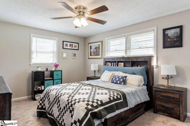 411 Granada Dr, Spartanburg, SC 29303 - bedroom with light colored carpet, a ceiling fan, a textured ceiling, and baseboards