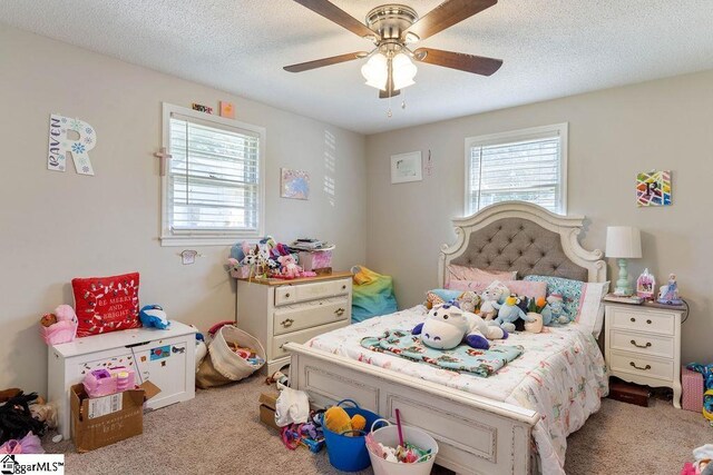 411 Granada Dr, Spartanburg, SC 29303 - bedroom with a ceiling fan, multiple windows, and light colored carpet