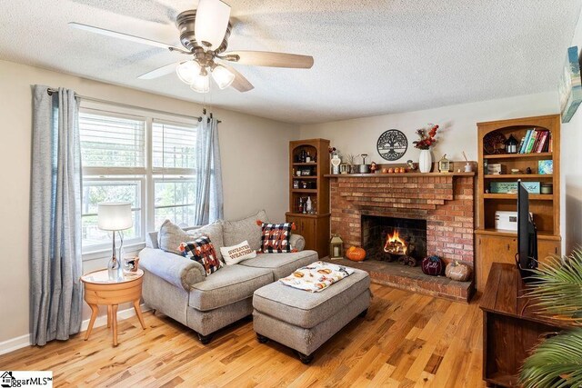 411 Granada Dr, Spartanburg, SC 29303 - living room featuring a textured ceiling, wood finished floors, and ceiling fan