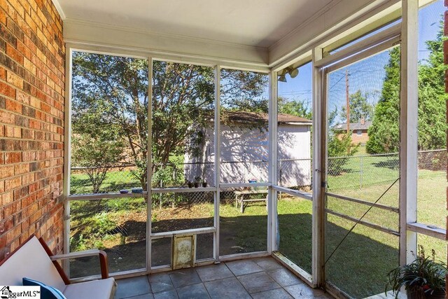 411 Granada Dr, Spartanburg, SC 29303 - unfurnished sunroom featuring a water view