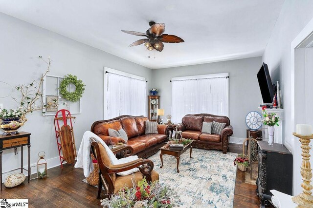15 S Greenwood Ave, Ware Shoals, SC 29629 - living room featuring hardwood / wood-style floors, baseboards, and a ceiling fan