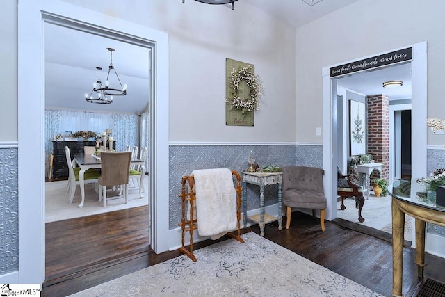 15 S Greenwood Ave, Ware Shoals, SC 29629 - sitting room featuring wood finished floors, a chandelier, and wainscoting