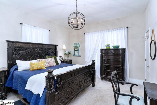 15 S Greenwood Ave, Ware Shoals, SC 29629 - carpeted bedroom featuring an inviting chandelier