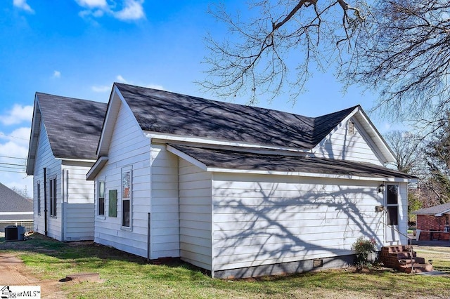 15 S Greenwood Ave, Ware Shoals, SC 29629 - view of side of property with cooling unit, a shingled roof, and entry steps