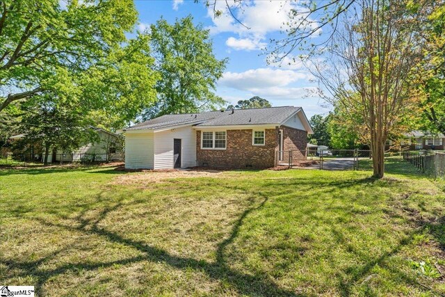 118 Rodney St, Moore, SC 29369 - rear view of property with a lawn, crawl space, a fenced backyard, and brick siding