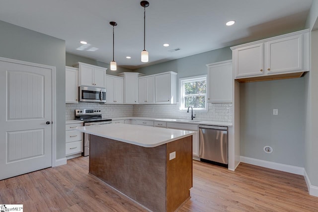 104 Pawleys Ct, Anderson, SC 29625 - kitchen with backsplash, appliances with stainless steel finishes, light wood-style flooring, and a sink