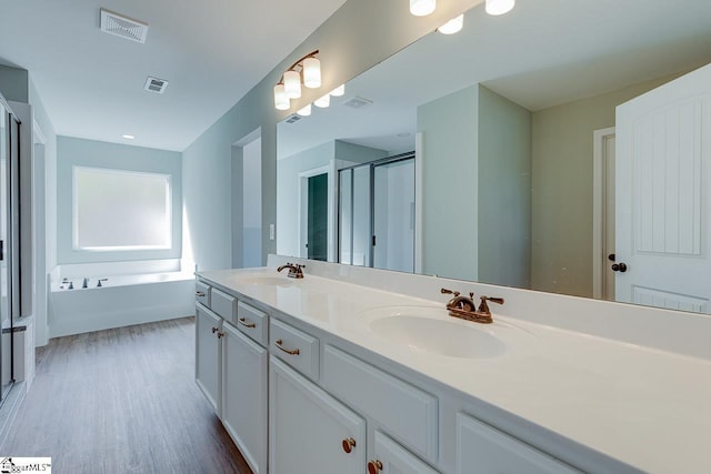 104 Pawleys Ct, Anderson, SC 29625 - full bathroom with a sink, visible vents, a shower stall, and wood finished floors