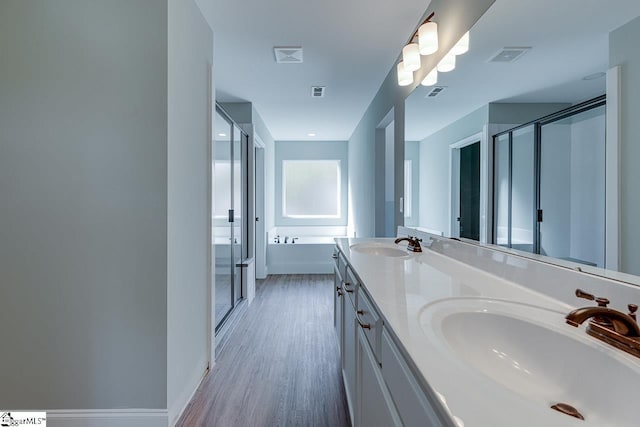 104 Pawleys Ct, Anderson, SC 29625 - bathroom with wood finished floors, a shower stall, visible vents, and a sink
