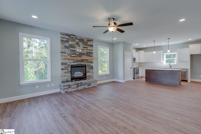 104 Pawleys Ct, Anderson, SC 29625 - unfurnished living room with plenty of natural light, a ceiling fan, and light wood-style flooring
