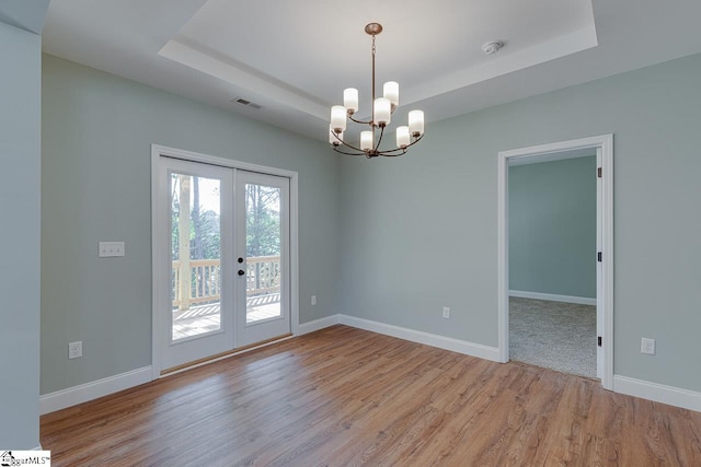 104 Pawleys Ct, Anderson, SC 29625 - unfurnished room featuring an inviting chandelier, light wood-type flooring, visible vents, french doors, and a tray ceiling