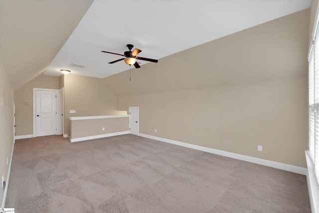 bonus room with visible vents, ceiling fan, light colored carpet, and vaulted ceiling