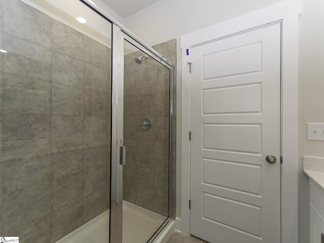bathroom featuring a shower stall