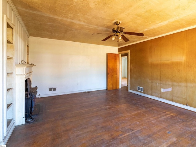 2006 E N St, Greenville, SC 29607 - unfurnished living room featuring visible vents, wood finished floors, a ceiling fan, and a large fireplace