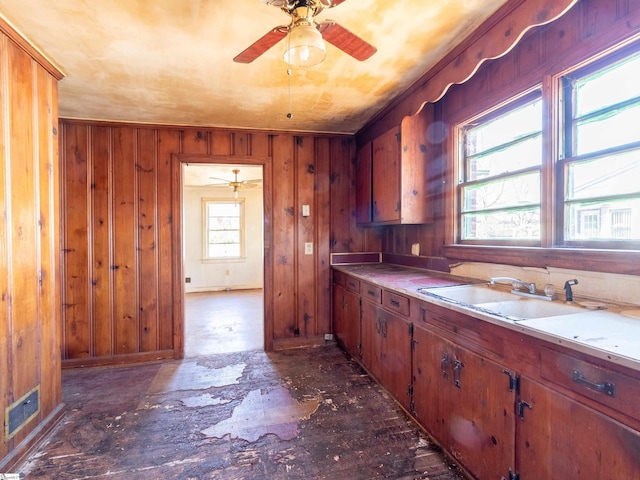 2006 E N St, Greenville, SC 29607 - kitchen with light countertops, a sink, visible vents, a ceiling fan, and wooden walls
