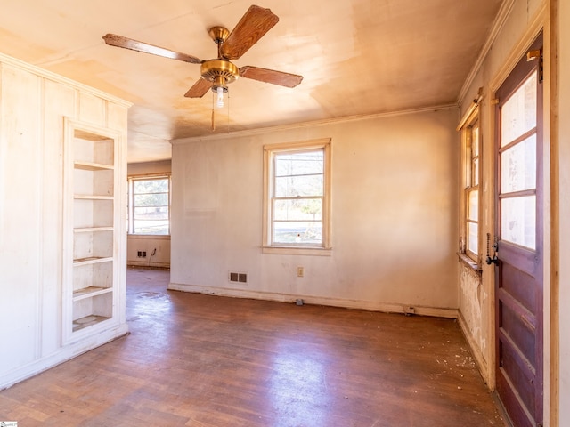 2006 E N St, Greenville, SC 29607 - spare room featuring visible vents, wood finished floors, ornamental molding, and built in shelves