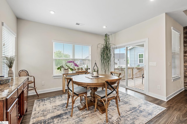dining area with visible vents, recessed lighting, dark wood finished floors, and baseboards
