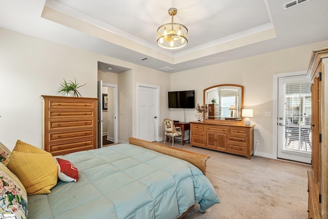bedroom with access to outside, a tray ceiling, visible vents, baseboards, and light colored carpet