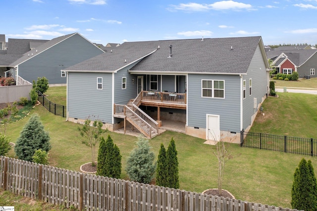 rear view of house with stairs, a deck, roof with shingles, crawl space, and a fenced backyard