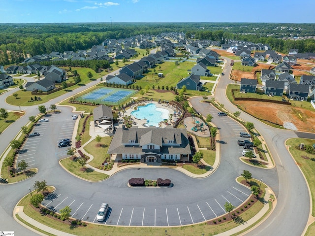birds eye view of property with a residential view