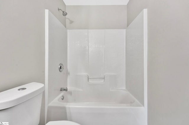 bathroom featuring toilet and shower / bath combination
