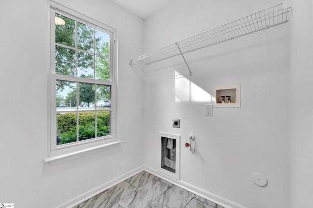 laundry area with washer hookup, laundry area, electric dryer hookup, baseboards, and gas dryer hookup