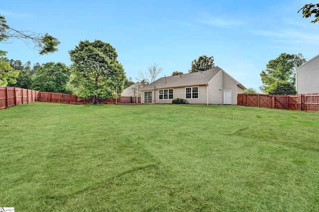 view of yard with a fenced backyard