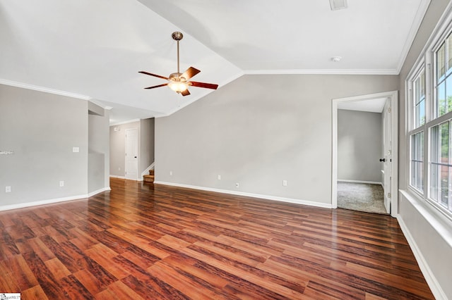 spare room with stairway, baseboards, ornamental molding, wood finished floors, and a ceiling fan