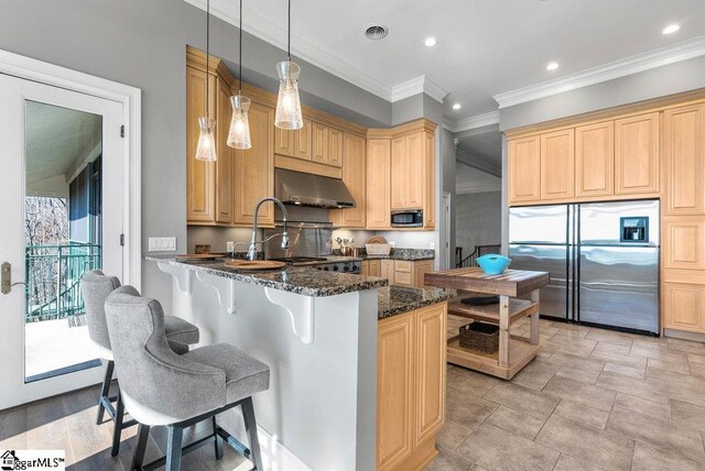 400 Stony Rd, Landrum, SC 29356 - kitchen with dark stone countertops, a breakfast bar, stainless steel appliances, exhaust hood, and a peninsula