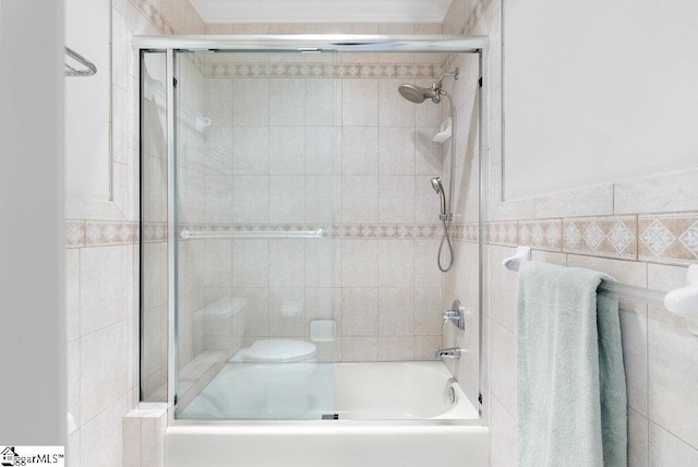 400 Stony Rd, Landrum, SC 29356 - full bathroom with bath / shower combo with glass door, toilet, and tile walls