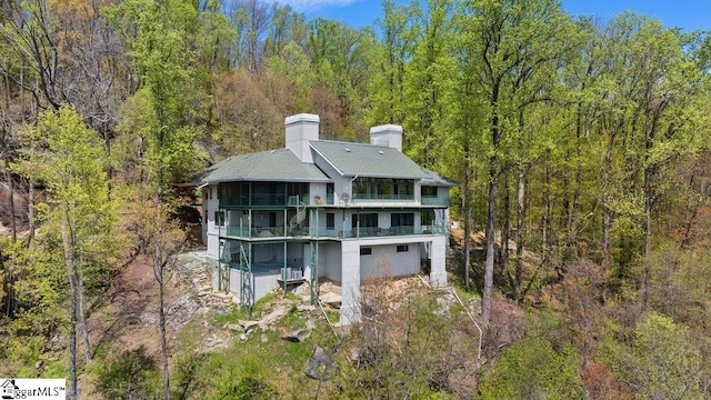 400 Stony Rd, Landrum, SC 29356 - rear view of house featuring a chimney, a forest view, and a balcony