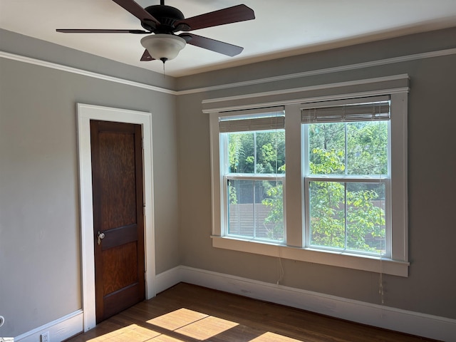 305 E Cherokee St, Chesnee, SC 29323 - empty room with baseboards, ceiling fan, and wood finished floors