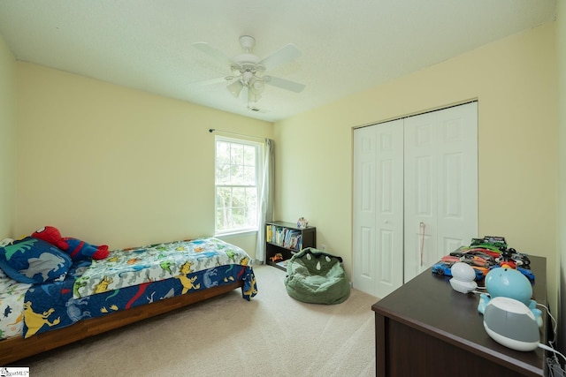bedroom with a closet, a ceiling fan, carpet, and visible vents