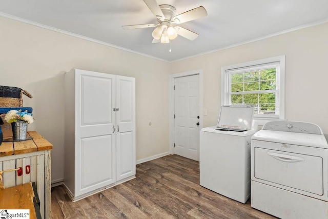 laundry area with wood finished floors, a ceiling fan, crown molding, and washing machine and dryer