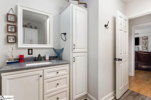 bathroom featuring vanity and wood finished floors