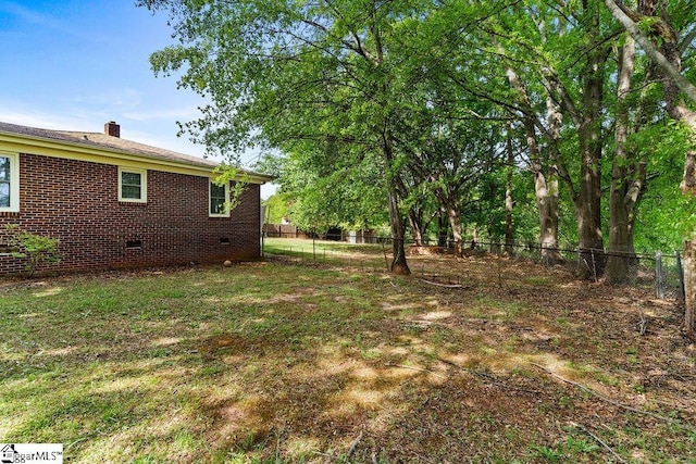 view of yard featuring fence