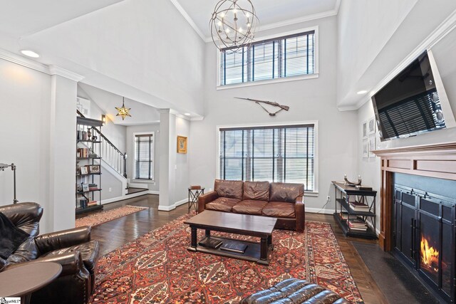 25 Palladio Dr, Greenville, SC 29617 - living room featuring a fireplace with flush hearth, stairway, a wealth of natural light, crown molding, and wood finished floors