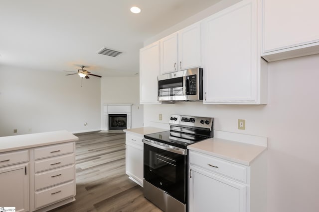9 Dunsborough Dr, Simpsonville, SC 29680 - kitchen featuring appliances with stainless steel finishes, visible vents, ceiling fan, light countertops, and wood finished floors