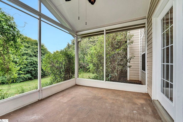 unfurnished sunroom featuring a wealth of natural light and ceiling fan