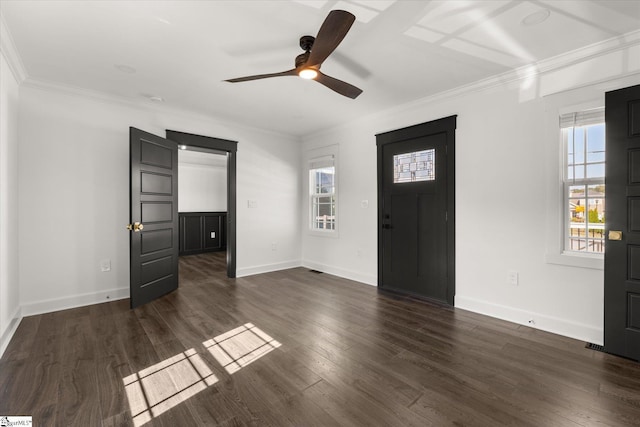 foyer entrance with ceiling fan, crown molding, and plenty of natural light