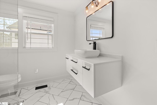 bathroom featuring vanity, toilet, crown molding, marble finish floor, and visible vents