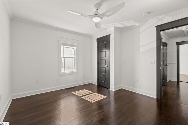 unfurnished bedroom featuring crown molding, visible vents, ceiling fan, baseboards, and dark wood-style flooring