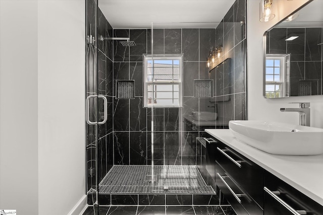 bathroom featuring a stall shower, vanity, and marble finish floor
