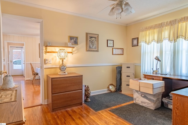 bedroom featuring baseboards, ornamental molding, and wood finished floors