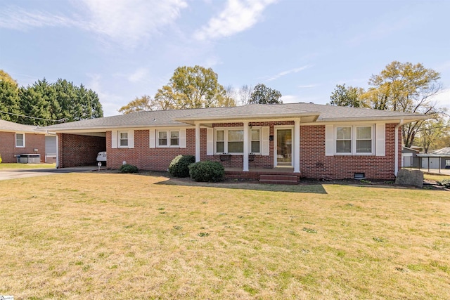 ranch-style house with a front lawn, covered porch, an attached carport, brick siding, and driveway