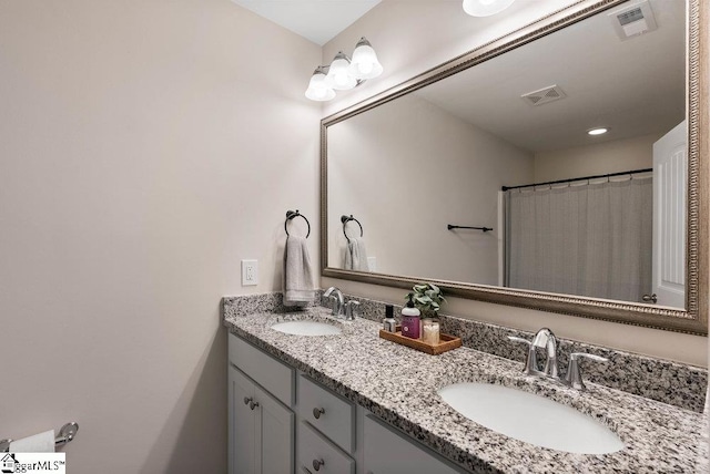 149 Bruinen Dr, Fountain Inn, SC 29644 - bathroom featuring double vanity, visible vents, and a sink