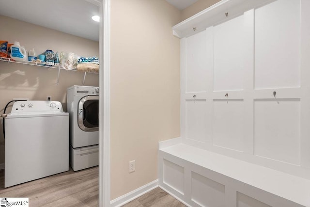 149 Bruinen Dr, Fountain Inn, SC 29644 - laundry room with light wood finished floors, washing machine and clothes dryer, laundry area, and baseboards