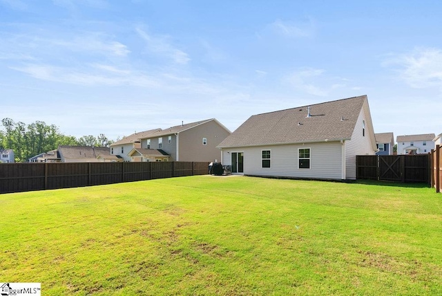 149 Bruinen Dr, Fountain Inn, SC 29644 - rear view of house featuring a yard and a fenced backyard