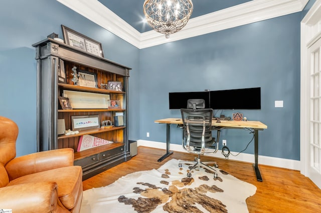office area with crown molding, baseboards, an inviting chandelier, and wood finished floors