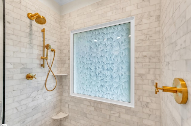 bathroom with a tile shower